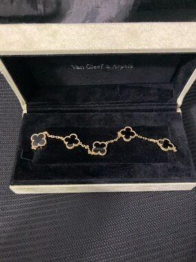 Van Cleef & Arpels Gold Bracelet with Black Onyx Clover Motifs